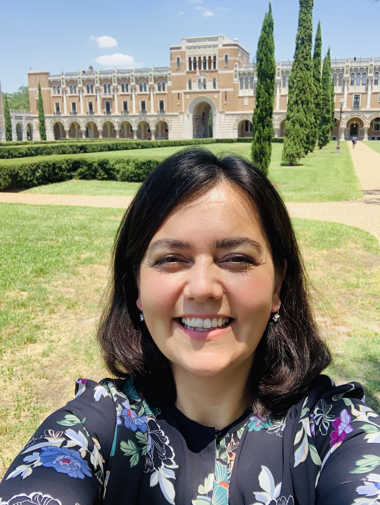 Betul Orcan-Ekmekci standing on the Rice University academic quad in front of Lovett Hall.